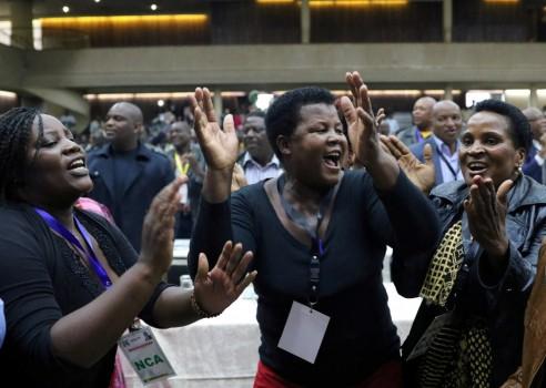 Delegates celebrate after Zimbabwean President Robert Mugabe was dismissed as party leader at an extraordinary meeting of the ruling ZANU-PF's central committee in Harare, Zimbabwe November 19, 2017.