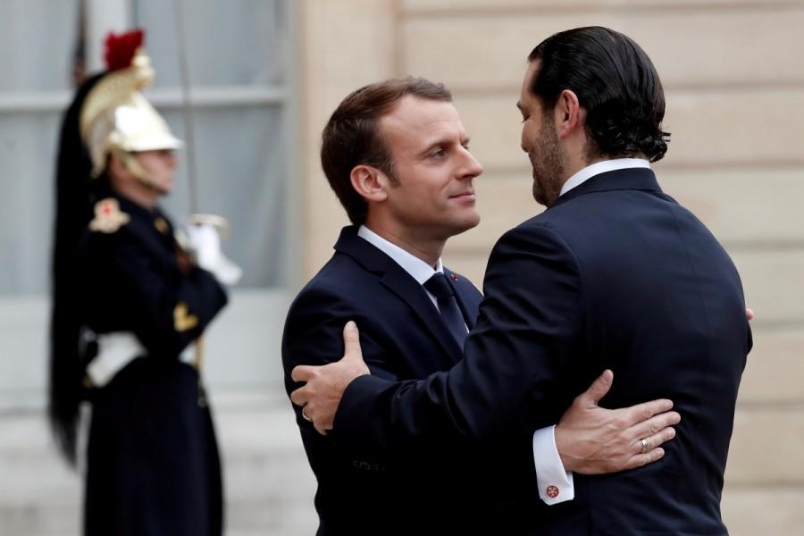 French President Emmanuel Macron and Saad al-Hariri, who announced his resignation as Lebanon's prime minister while on a visit to Saudi Arabia, embrace in the courtyard of the Elysee Palace in Paris, France, November 18, 2017. Saad al-Hariri,Lebanon’s Prime Minister Saad al-Hariri,PM Saad al-Hariri,Emmanuel Macron,President Emmanuel Macron,Lebanon