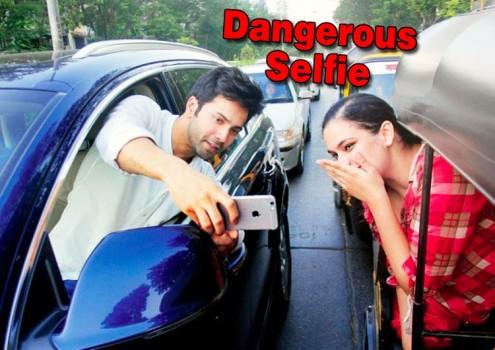 The official Twitter handle of Mumbai Police shared snapshots of a newspaper article featuring Varun pulling off the selfie stunt on the road. The actor is seen partly out of his car's window and taking a selfie with a female fan who is seen travelling in an auto rickshaw.