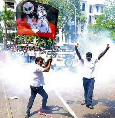 AIADMK workers celebrate outside party headquarters soon after media reported that the Election Commission has alloted 'two leaves' symbol to the EPS-OPS faction. Two leaves,Dhinakaran Two Leaves Symbol,AIADMK Two Leaves Symbol,AIADMK,Ruling AIADMK,AIADMK faction,E Palaniswam,O Panneerselvam