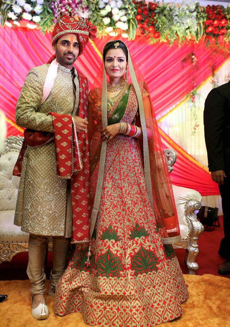 Bhuvneshwar Kumar and Nupur Nagar pose for the photographers. Bhuvneshwar Kumar,Bhuvneshwar Kumar wedding,Bhuvneshwar Kumar marriage,Bhuvneshwar Kumar and Nupur Nagar,Bhuvneshwar Kumar and Nupur Nagar wedding,Bhuvneshwar Kumar and Nupur Nagar marriage,Bhuvneshwar Kumar wedding pics,Bhuvneshwar Kumar wedding images,B