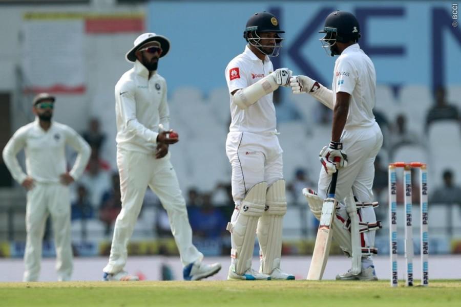 The former skipper's dismissal brought in Chandimal, who completed his 3,000 Test runs on his individual score of 24 when he drove Umesh Yadav for a boundary at mid-off. Chandimal continued to steady the ship, taking Sri Lanka past the three figure mark in the company of Karunaratne, who by now had neared his 14th Test half century. India vs Sri Lanka,India vs Sri Lanka 2017,India vs Sri Lanka 2nd Test,India vs Sri Lanka score,India vs Sri Lanka live,Chandimal,Dinesh Chandimal