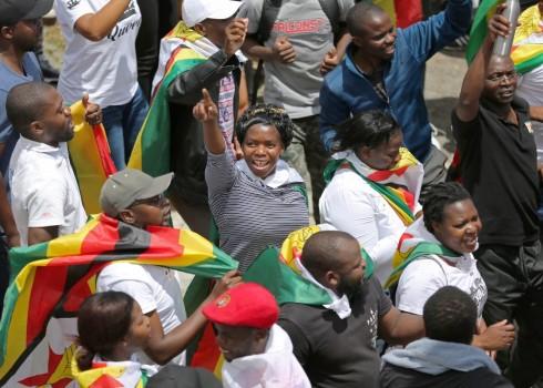 Protesters march calling for Zimbabwean President Robert Mugabe to step down in Cape Town, South Africa, November 18, 2017.