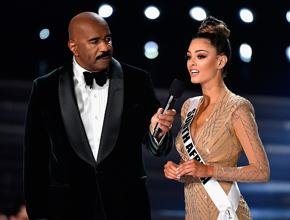 Television personality and host Steve Harvey (L) speaks to Miss South Africa 2017 Demi-Leigh Nel-Peters during the interview portion of2017 Miss Universe Pageant at The Axis at Planet Hollywood Resort & Casino on November 26, 2017 in Las Vegas, Nevada. Miss universe 2017,miss universe 2017 winner,Miss Universe 2017 winner South Africa,Miss Universe 2017 Demi-Leigh Nel-Peters,Miss Universe 2017 best evening gown,Miss Universe 2017 best swimwear,Miss Universe 2017 top 5,Miss Universe 2017 top 3,Miss South