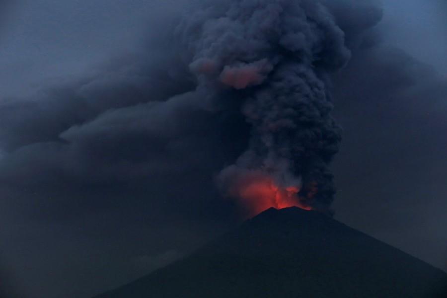 Glowing light of hot lava is seen during the eruption of Mount Agung as seen from Amed in Karangasem, Bali, Indonesia, November 27, 2017. Mount Agung,Mount Agung volcano,Mount Agung spewing smoke,cracks on Mount Agung,Bali volcano,Bali volcano erupts,Bali volcano eruption