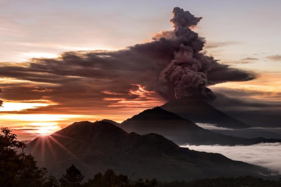 Mount Agung volcano is seen spewing smoke and ash in Bali, Indonesia, November 26, 2017 in this picture obtained from social media. Mount Agung,Mount Agung volcano,Mount Agung spewing smoke,cracks on Mount Agung,Bali volcano,Bali volcano erupts,Bali volcano eruption