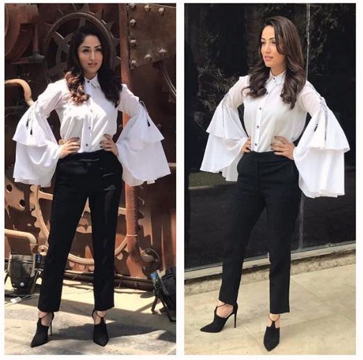 A classy twist to the usual formals: She is flaunting a breezy vibe in this awesome outfit. She made added a twist to usual formal look in this beautiful white top with ruffled elongated sleeves. The embroidery on the shoulders adds to her oomph factor. Yami Gautam,actress Yami Gautam,Yami Gautam fashion,Yami Gautam amazing fashion,Yami Gautam dress,Yami Gautam hot pics,Yami Gautam hot images,Yami Gautam hot stills,Yami Gautam hot pictures,Yami Gautam hot photos