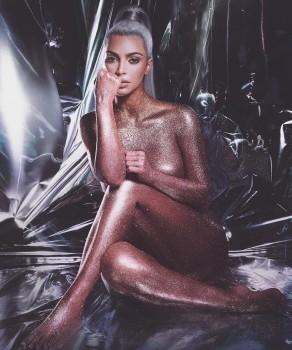 Model Kim Kardashian breaks the internet by posing nude in glitter body paint for KKW beauty line.
