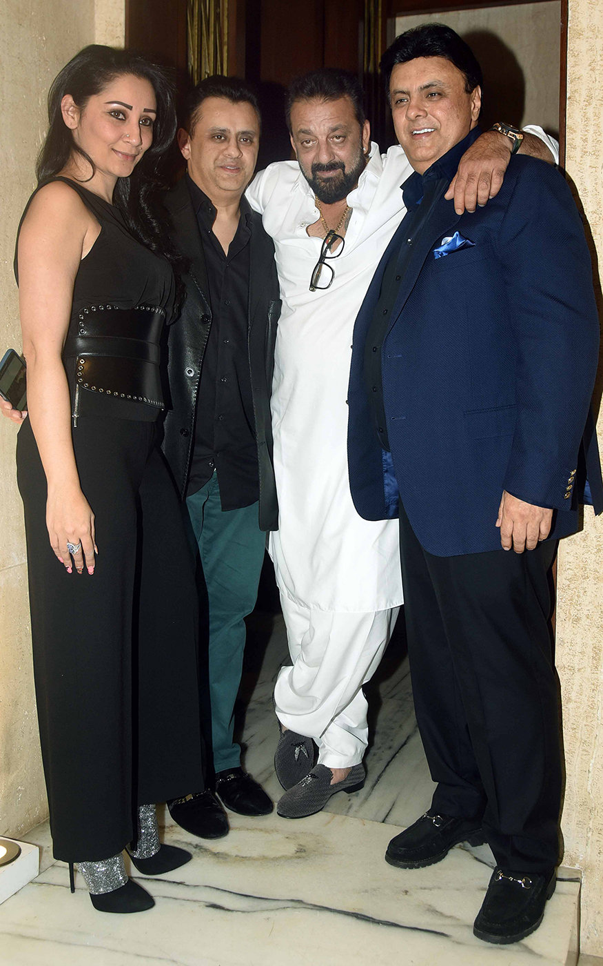 Sanjay and Manyata Dutt pose with friends during Manish Malhotra Sanjay Dutt,Sophie Choudry,Raveena Tandon,Manish Malhotra's Get-Together Party,Manish Malhotra,celebs at Manish Malhotra's Get-Together Party,Manish Malhotra's Get-Together Party pics,Manish Malhotra's Get-Together Party images,Manish