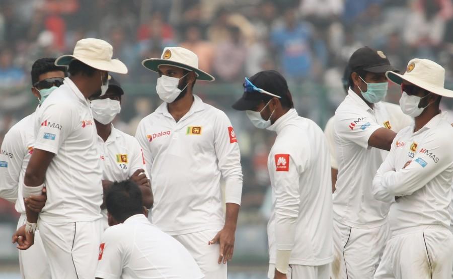 On Sunday, Delhi-NCR inhaled toxins as at least seven out of 22 monitoring stations registered a "severe plus or emergency" level of air quality. During the Sunday match, six visiting Sri Lanka players wore masks while fielding after the lunch session at the Feroz Shah Kotla Stadium. Umpires discussed the issue with the players and the match was halted for about 15 minutes. Sri Lankan players wear face masks,India vs Sri Lanka,India vs Sri Lanka 2017,India vs Sri Lanka 3rd Test,Delhi pollution,Delhi smog,delhi air pollution