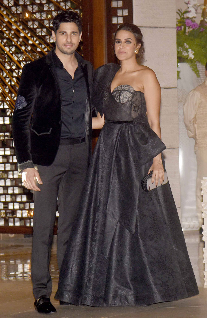 Sidharth Malhotra and Neha Dhupia pose together as they arrive at Mukesh Ambani's party in Mumbai. Kareena Kapoor,Alia Bhatt,Katrina Kaif,Sridevi Kapoor,Jacqueline Fernandez,Mukesh Ambani's Party,Mukesh Ambani Party,celebs at Mukesh Ambani Party