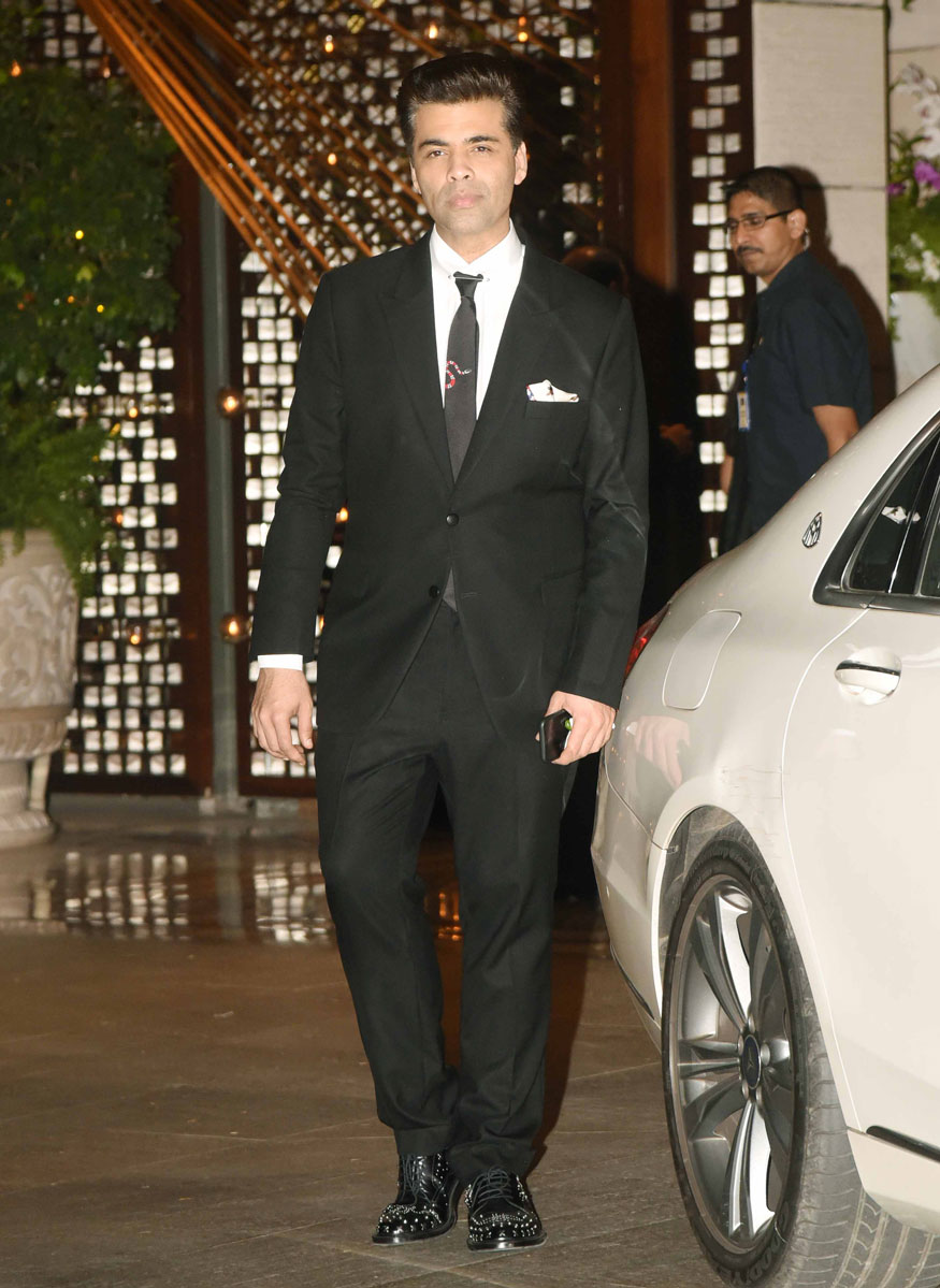 Karan Johar poses for the cameras at Mukesh Ambani's party in Mumbai. Amitabh Bachchan,Shah Rukh Khan,Sachin Tendulkar,Karan Johar,Mukesh Ambani Party,Mukesh Ambani Party pics,Mukesh Ambani Party images,Mukesh Ambani Party stills,Mukesh Ambani Party pictures,Mukesh Ambani Party photos