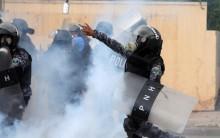 A military policeman throws a gas canister toward supporters of Salvador Nasralla during a protest caused by the delayed vote count for the presidential election in Tegucigalpa, Honduras November 30, 2017.