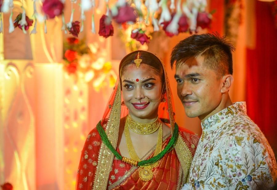 With renowned names from politics and sports in attendance, Indian soccer team captain Sunil Chhetri wed his long-time girlfriend Sonam Bhattacharya at a posh city club on Monday. Smartly turned out in a traditional Nepali attire, Chhetri rode to the wedding hall on a horse, and later changed into a printed sherwani as per Bengali tradition. Sunil Chhetri,Sunil Chhetri weds Sonam Bhattacharya,Sonam Bhattacharya,Sunil Chhetri wedding pics,Sunil Chhetri wedding images,Sunil Chhetri wedding stills,Sunil Chhetri wedding pictures,Sunil Chhetri wedding photos