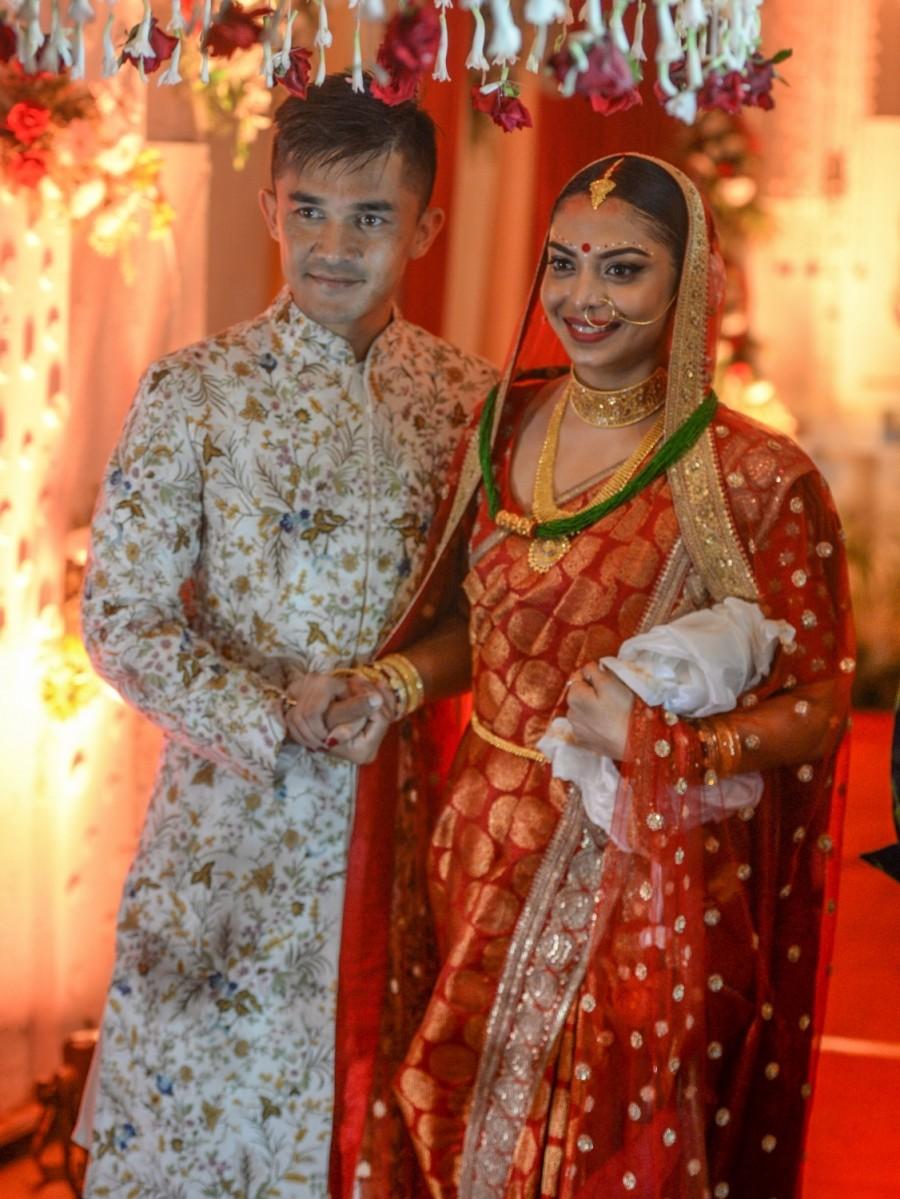Chhetri, 33, plies his trade for Bengaluru FC and is currently playing in the fourth edition of Indian Super League. The wedding ceremony took place after Bengaluru FC's away game against FC Goa which they lost 3-4. Sonam, the daughter of Mohun Bagan soccer legend Subrata Bhattacharya, is a business management graduate from Scotland. Sunil Chhetri,Sunil Chhetri weds Sonam Bhattacharya,Sonam Bhattacharya,Sunil Chhetri wedding pics,Sunil Chhetri wedding images,Sunil Chhetri wedding stills,Sunil Chhetri wedding pictures,Sunil Chhetri wedding photos