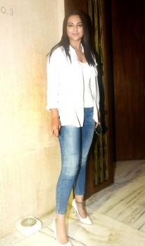 Sonakshi Sinha poses for photographers during Manish Malhotra's birthday party.