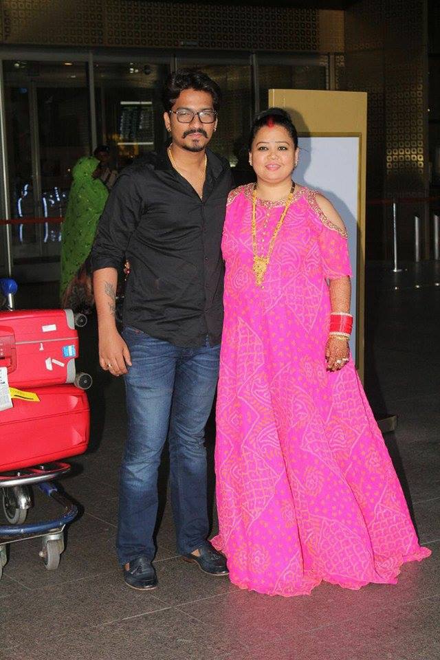 Newlywed Bharti Singh and Haarsh Limbachiyaa spotted at Mumbai Airport after tying the knot in a three-day extravaganza in Goa. Bharti Singh and Haarsh Limbachiyaa,Bharti Singh,Haarsh Limbachiyaa,Bharti Singh spotted at Mumbai Airport,Haarsh Limbachiyaa spotted at Mumbai Airport