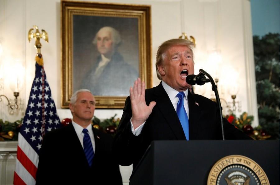 With Vice Pence Mike Pence looking on, President Donald Trump gives a statement on Jerusalem, during which he recognized Jerusalem as the capital of Israel, in the Diplomatic Reception Room of the White House in Washington. Donald Trump,President Donald Trump,Jerusalem decision,Jerusalem,jerusalem violence