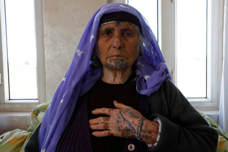 Fatma Dogru, 70, poses as she speaks about her tattoos at her home in Kisas village in southeastern province of Sanliurfa, Turkey. Tattooed women,Ayse Yusufoglu,Turkey women