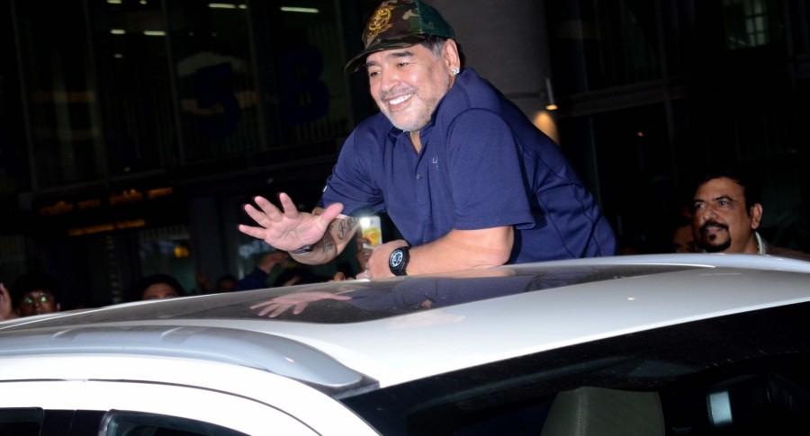 Amid much fanfare and tight security, Argentine football legend Diego Maradona reached the city for a three-day visit on Sunday. The iconic player, who is now coach of the Dubai-based club Al-Fujairah SC, was seen waving at fans before getting into the car, flashing the 'victory' sign at camerapersons and supporters and throwing flying kisses. He was wearing a navy-blue t-shirt and sported a military cap. Armando Maradona,Diego Armando Maradona,Maradona,Maradona in India,Maradona India