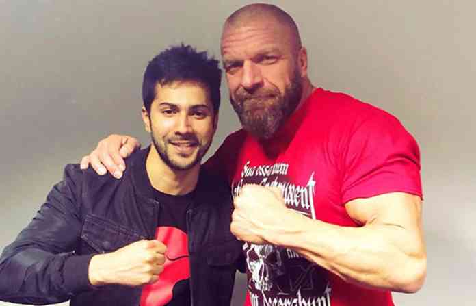 Popular wrestler Triple H said it was great meeting the "Badrinath Ki Dulhania" star and added: "Hope you enjoyed your first time in a WWE ring!" Varun, an ardent fan of WWE, even took photographs with Triple H. The WWE Live event was held at the Indira Gandhi Indoor Stadium on Saturday. Varun Dhawan meets Triple H,Varun Dhawan meets Sasha Banks,Varun Dhawan,Sasha Banks,Triple H,Triple H in India