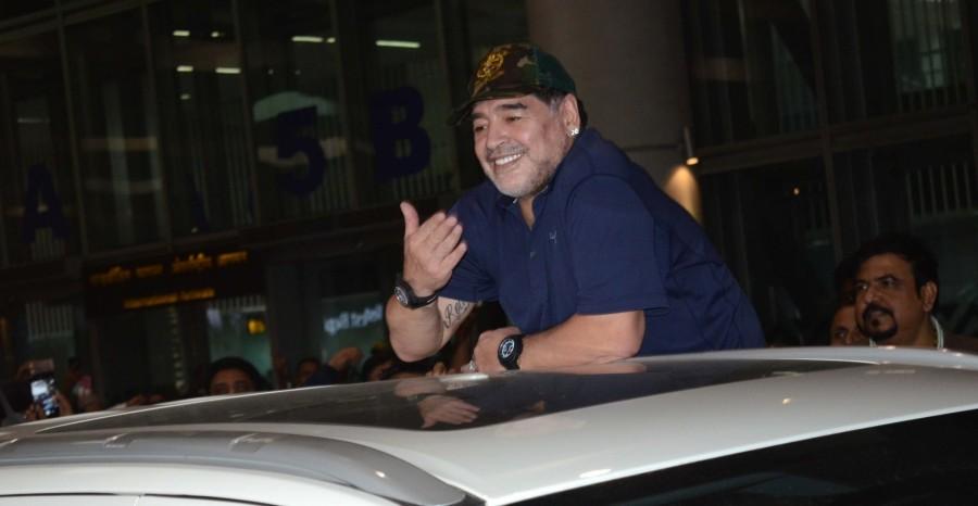 He was accompanied by partner Rocio Oliva who was seen sitting inside the car. Maradona will play a charity football match against former India captain Sourav Ganguly on Tuesday at Barasat, West Bengal. The trip was originally slated to take place in October but was postponed several times. This is the former Napoli star's second visit to the eastern metropolis. Armando Maradona,Diego Armando Maradona,Maradona,Maradona in India,Maradona India