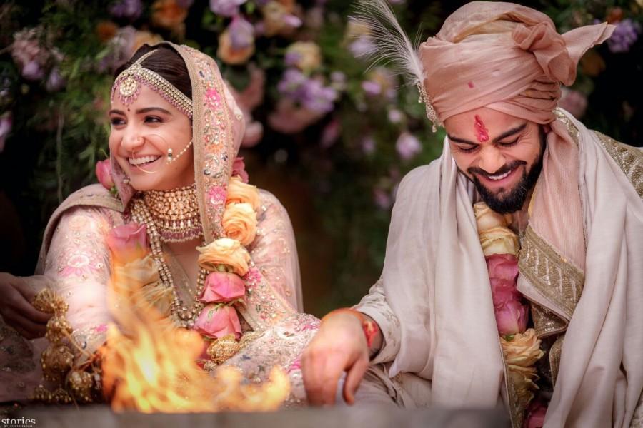Indian cricket team captain Virat Kohli and Bollywood actress Anushka Sharma sealed their relationship with a wedding here amidst close family and friends on Monday. "Today we have promised each other to be bound in love forever. We are truly blessed to share the news with you," Virat and Anushka posted on their social media accounts. Virat Kohli,Anushka Sharma,Virat Kohli and Anushka Sharma,Virat Kohli and Anushka Sharma marriage,Virat Kohli and Anushka Sharma wedding images,Virat Kohli and Anushka Sharma wedding stills