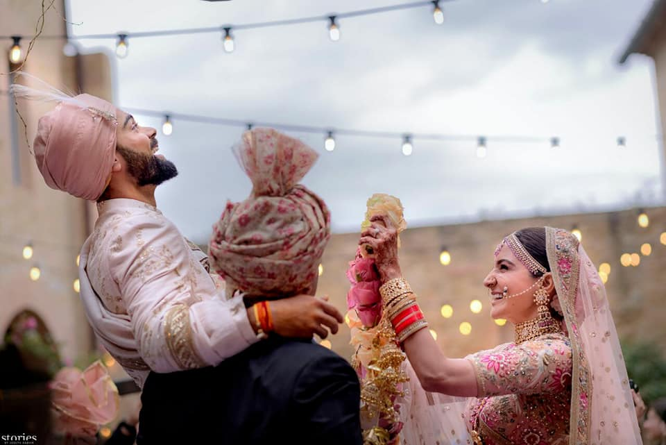 The wedding was solemnised as per Hindu rituals at 2 p.m. here, with the bride and groom looking resplendent in ensembles by celebrated couturier Sabyasachi Mukherjee. Virat Kohli,Anushka Sharma,Virat Kohli and Anushka Sharma,Virat Kohli and Anushka Sharma marriage,Virat Kohli and Anushka Sharma wedding images,Virat Kohli and Anushka Sharma wedding stills