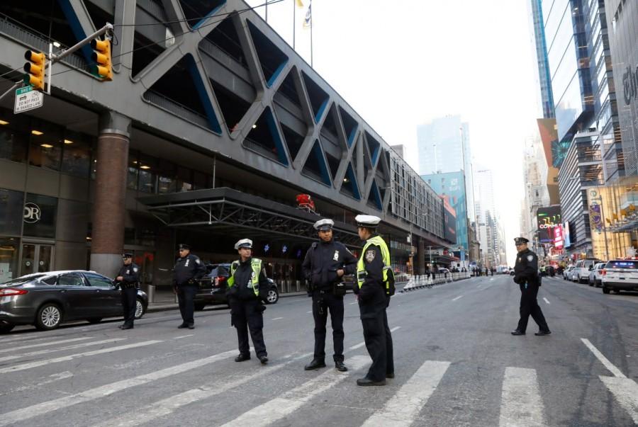 Police officers stand outside the New York Port Authority Bus Terminal. Explosion rocks,New York,New York Port Authority
