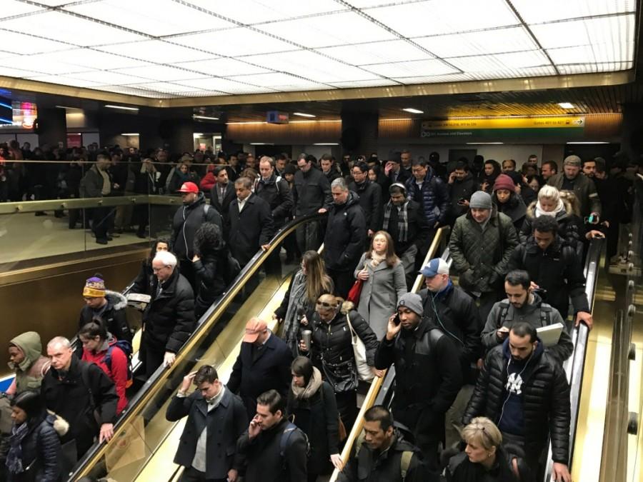 Commuters exit the New York Port Authority. Explosion rocks,New York,New York Port Authority