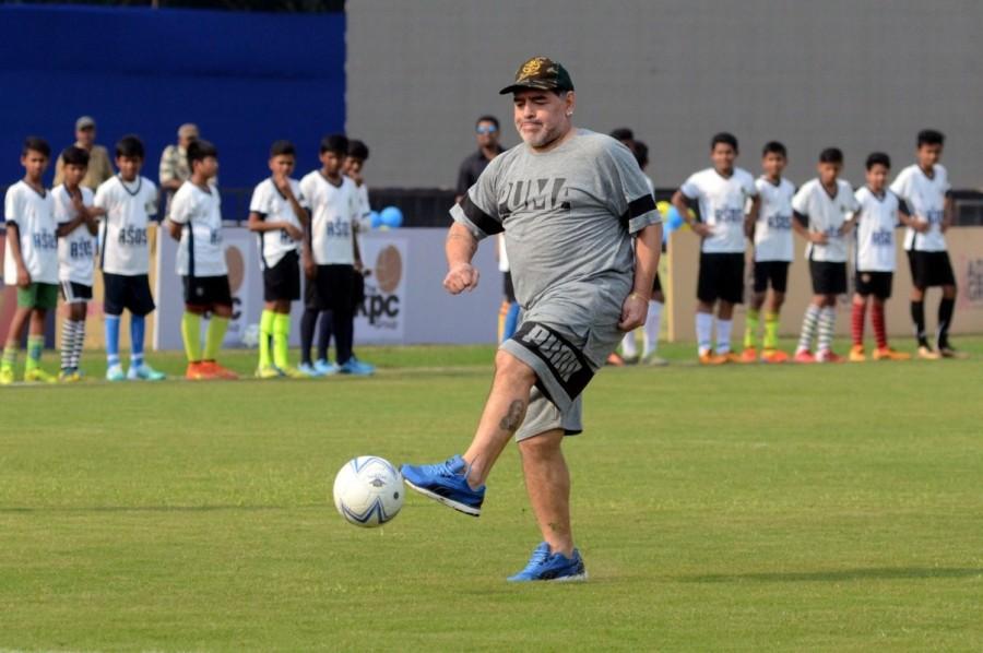 Television cameras and photographers were also not accommodated property leading to chaos while trying to get a good click of the legend. Maradona, though, kicked off the match and shook hands with the players and Ganguly. Former India footballers Shyam Thapa, Prasun Banerjee, Dipendu Biswas, Sisir Ghosh, Biswajit Bhattacharya, Alvito D'Cunha were among those who took part in the match along with Bengal cricket captain Manoj Tiwary and fast bowler Shib Shankar Paul. Maradona was seen engaging with the Aditya School of Sports students - all wearing the famous No 10 of the great - actively passing the ball around to them and giving them penalty practice. Diego Maradona,Sourav Ganguly,Diego Maradona Kolkata,Diego Maradona skips football match