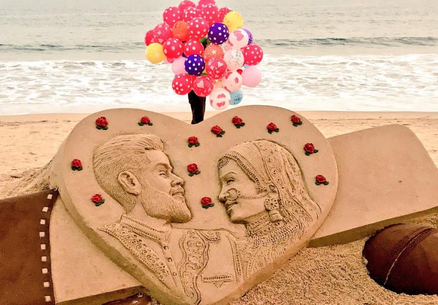 Sudarsan Pattnaik's beautiful Sand Art ft. Virat Kohli and Anushka Sharma at Puri Beach in Odisha. Anushka Sharma-Virat Kohli marriage,Anushka Sharma-Virat Kohli wedding,Sand artist Sudarsan Pattnaik,Sudarsan Pattnaik,Anushka Sharma-Virat Kohli sand art