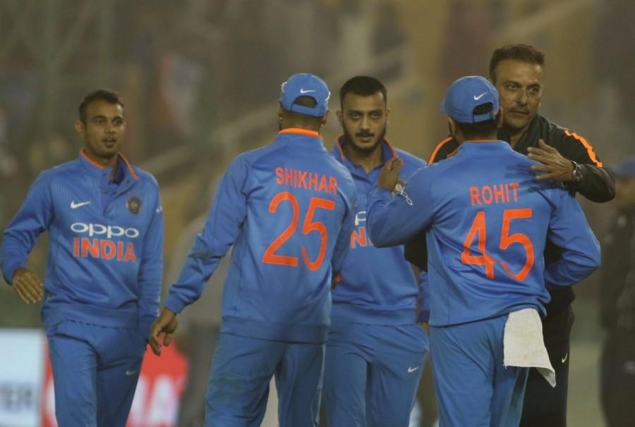Indian players celebrate after winning the second One Day International (ODI) match against Sri Lanka at Punjab Cricket Association IS Bindra Stadium in Mohali on Dec 13, 2017. India vs Sri Lanka 2nd ODI,India vs Sri Lanka,India vs Sri Lanka 2017,Rohit Sharma,Rohit Sharma third ODI double,Rohit Sharma double hundred