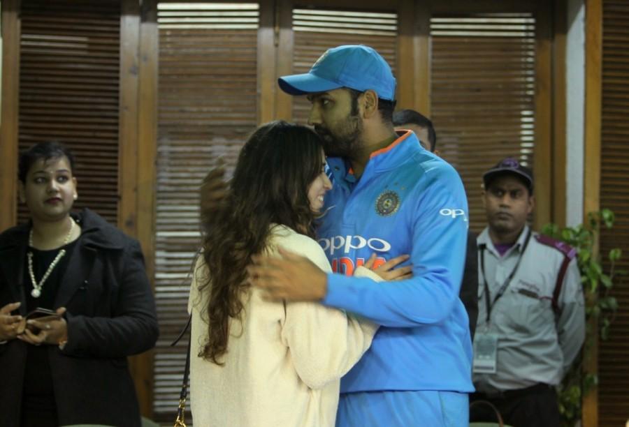 Indian cricketer Rohit Sharma with his wife Ritika Sajdeh after he became the first cricketer to score three double hundred in the One-Day International (ODI), at Punjab Cricket Association IS Bindra Stadium in Mohali. Rohit Sharma-Ritika Sajdeh,Rohit Sharma,Ritika Sajdeh,Rohit Sharma with his wife Ritika Sajdeh,India vs Sri Lanka,India vs Sri Lanka 2017