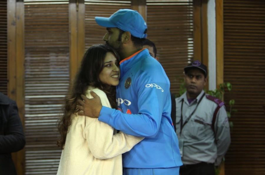 Indian cricketer Rohit Sharma with his wife Ritika Sajdeh after he became the first cricketer to score three double hundred in the One-Day International (ODI), at Punjab Cricket Association IS Bindra Stadium in Mohali on Dec 13, 2017. Rohit Sharma-Ritika Sajdeh,Rohit Sharma,Ritika Sajdeh,Rohit Sharma with his wife Ritika Sajdeh,India vs Sri Lanka,India vs Sri Lanka 2017