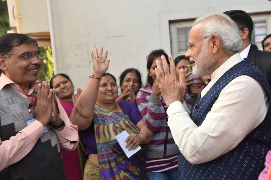 Modi had flown to Ahmedabad to cast his vote after formally commissioning the first of the Scorpene-class submarines - INS Kalvari - in the Indian Navy in Mumbai. Gujarat Assembly elections,Gujarat Assembly elections second phase,gujarat assembly elections 2017,Narendra Modi casts his vote,Narendra Modi,PM Narendra Modi,Modi casts vote,Modi casts vote in Gujarat polls,INS Kalvari
