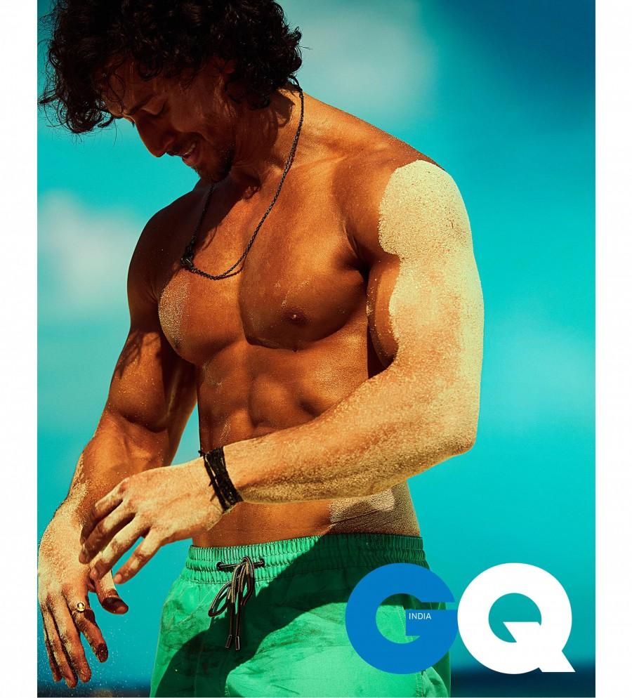 As opposed to his general serious look, here we get a candid look at Tiger smiling as he brushes off some sand from his magically hot body. This picture is surely something which can be looked at over and over again. Tiger Shroff,actor Tiger Shroff,hot Tiger Shroff,Tiger Shroff on GQ,GQ magazine