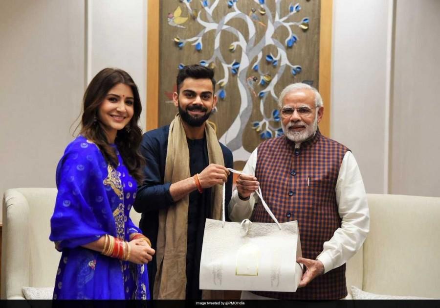 "Captain of the Indian cricket team @imVkohli and noted actor @AnushkaSharma met PM @narendramodi this evening. The Prime Minister congratulated them on their wedding," said PMO's Twitter handle in a caption accompanying a picture of the meeting. Virat Kohli,Anushka Sharma,Virat Kohli and Anushka Sharma,Virat Kohli Wedding Reception,Sharma Wedding Reception,Narendra Modi