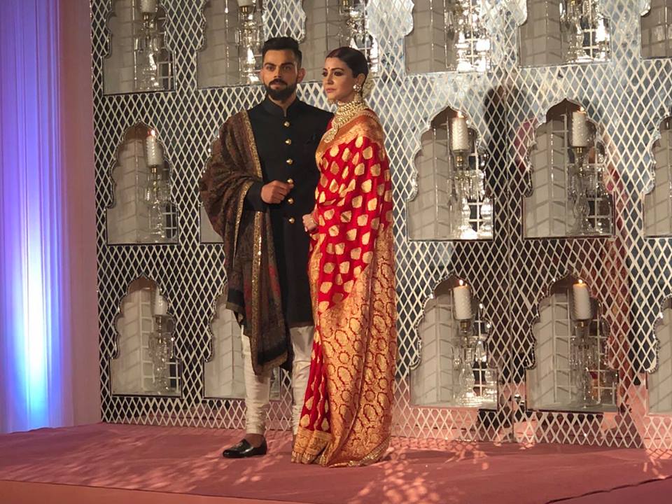 For the special occasion, Virat, who helped his wife onto the stage amid loud cheers, was wearing a black bandhgala with a shawl draped on one shoulder to complement his looks. Virat Kohli and Anushka Sharma,Virat Kohli,Anushka Sharma,Virat Kohli and Anushka Sharma wedding reception,Virat Kohli wedding reception,Anushka Sharma wedding reception,Virat Kohli and Anushka Sharma wedding reception pics,Virat Kohli and Anushka Sharma