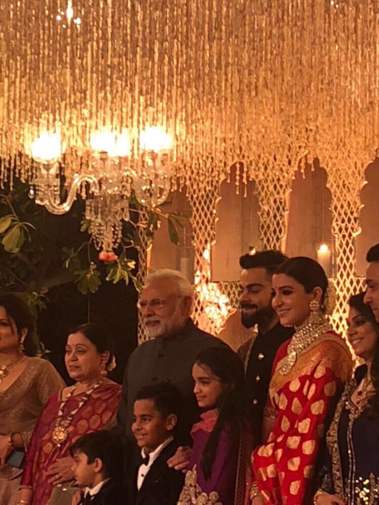 For the special occasion, Virat, who helped his wife onto the stage amid loud cheers, was wearing a black bandhgala with a shawl draped on one shoulder to complement his looks. Narendra Modi,PM Narendra Modi,Narendra Modi at Virat Kohli wedding reception,Narendra Modi at Anushka Sharma's wedding reception
