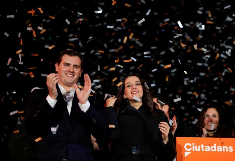 Catalan Ciudadanos leader Ines Arrimadas (C) smiles next to Ciudadanos national leader Albert Rivera at a Ciudadanos rally after results were announced in Catalonia's regional elections in Barcelona, Spain, December 21, 2017. Catalan separatists win vote,Catalan separatists,Spanish Prime Minister Mariano Rajoy,Mariano Rajoy