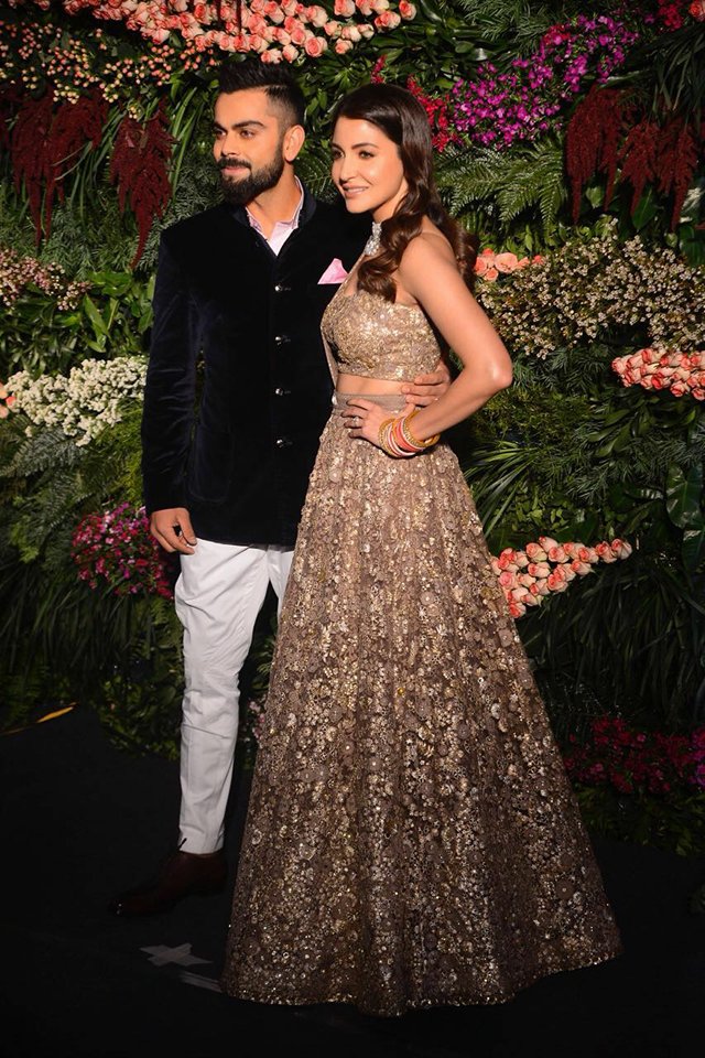 Hubby Virat wore a navy velvet bandhgala which he paired with a pair of white pants and brown shoes. Virat Kohli and Anushka Sharma,Virat Kohli and Anushka Sharma Mumbai reception,Virat Kohli and Anushka Sharma Mumbai reception pics,Virat Kohli and Anushka Sharma Mumbai reception images,Virat Kohli,Anushka Sharma