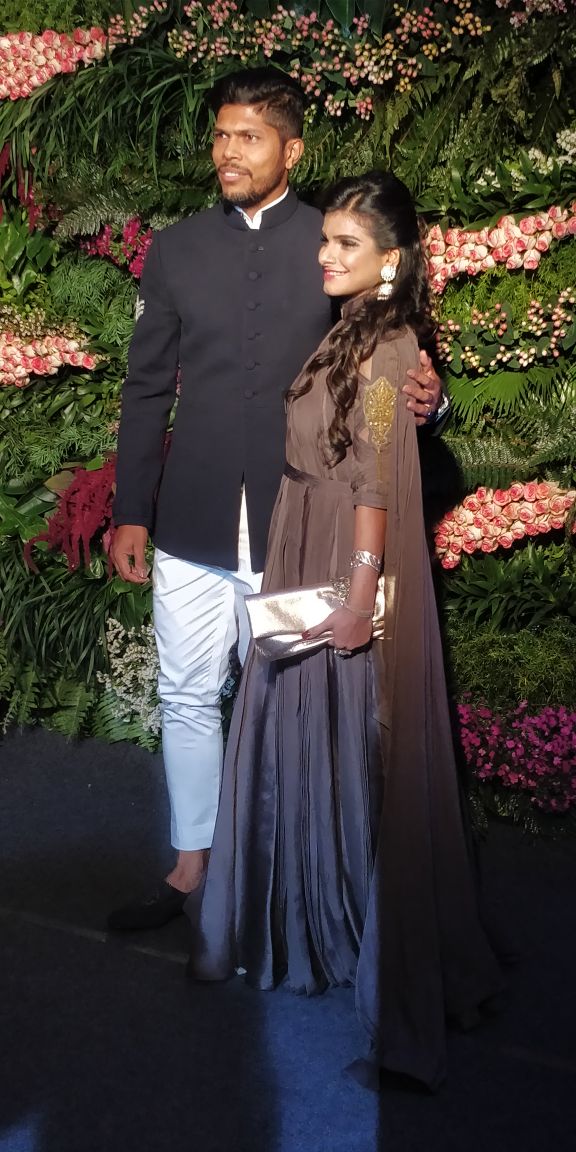Umesh Yaadav with his wife at Virat Kohli and Anushka Sharma reception. Umesh Yaadav,Virat Kohli and Anushka Sharma reception,Virat Kohli and Anushka Sharma mumbai reception,Virat Kohli mumbai reception,Anushka Sharma mumbai reception