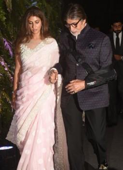Shweta and Amitabh Bachchan attend the wedding reception of Virat Kohli and Anushka Sharma held at St. Regis Hotel in Mumbai on December 26, 2017.