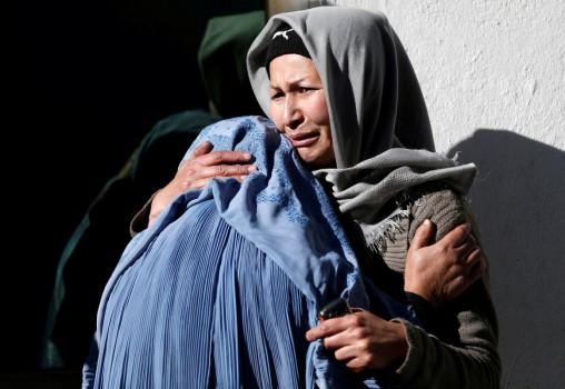 Afghan women mourn inside a hospital compound after a suicide attack in Kabul, Afghanistan December 28, 2017. Suicide bombers stormed a Shi'ite cultural centre and news agency in the Afghan capital on Thursday, killing more than 40 people and wounding scores, many of them students attending a conference.