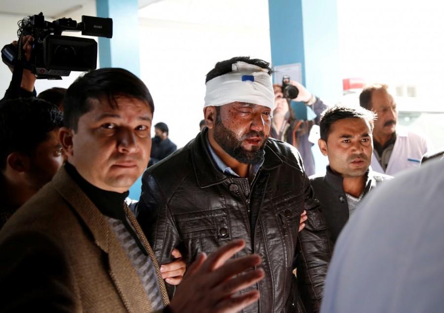 An injured man arrives at a hospital after a suicide attack in Kabul, Afghanistan December 28, 2017. Suicide attack,Shi'ite center,Shi'ite Suicide attack,Afghan capital,Suicide bombers