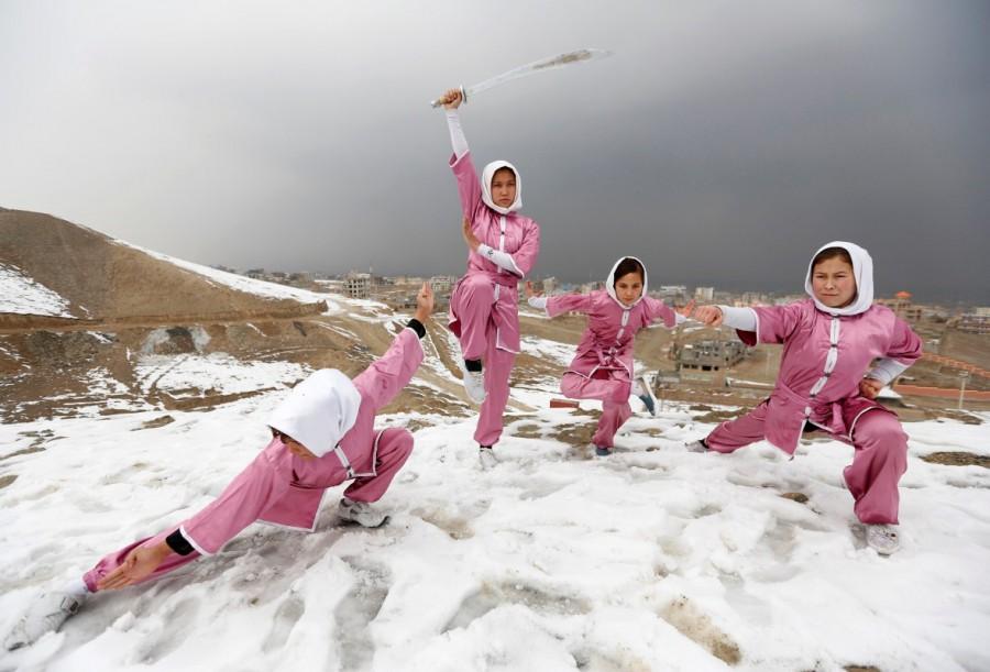 Hanifa Doosti (C), 17, and other students of the Shaolin Wushu club show their Wushu skills to other students on a hilltop in Kabul, Afghanistan January 29, 2017. Best pictures,Best pictures 2017,2017 Best pictures,2017 top pictures,2017 top pics,2017 top images,2017 top stills,2017 top photos