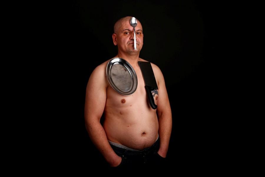 Nermin Halilagic, 38, poses with kitchen utensils in Bihac, Bosnia and Herzegovina January 23, 2017. Halilagic discovered earlier this year that he had the unusual ability to attach items to his body using what he says is a special energy radiated from his body. Without making any special preparation, he says he is able to hold on to spoons, forks, knives, and other kitchen appliances, as well as non-metal objects like remote controls, all plastic stuff, and cell phones. Picture taken January 23, 2017. Best pictures,Best pictures 2017,2017 Best pictures,2017 top pictures,2017 top pics,2017 top images,2017 top stills,2017 top photos