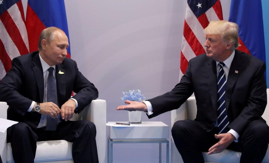 U.S. President Donald Trump meets with Russian President Vladimir Putin during their bilateral meeting at the G20 summit in Hamburg, Germany, July 7, 2017. Carlos Barria: "On July 7, I witnessed one of the most important meetings of President Trump's first year in office. Trump met Russian President Vladimir Putin during a bilateral meeting at the G20 summit in Germany. The world's eyes were on these two leaders after speculation about Russian interference during the 2016 US elections. We entered the room for less than two minutes, where I took dozens of pictures. But there was this very interesting moment when Trump extended his hand to Putin for a handshake. Putin paused for a second and looked at Trump's hand. That was the picture that I was looking for, a little moment that seemed to say a lot." President Donald Trump,Donald Trump,US President Donald Trump,Donald Trump viral moments