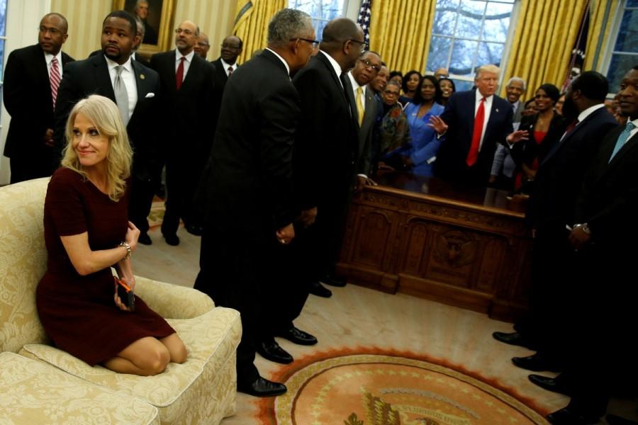 Senior advisor Kellyanne Conway (L) attends as U.S. President Donald Trump (behind desk) welcomes the leaders of dozens of historically black colleges and universities (HBCU) in the Oval Office at the White House in Washington, U.S., February 27, 2017. Jonathan Ernst: "We're often asked how much access we have to the Trump administration, and the answer is we have an awful lot. President Trump himself is very comfortable in the spotlight, and his aides are similarly unfazed by cameras. In this instance, senior advisor Kellyanne Conway was so comfortable in our presence she seemed not to consider the optics of kneeling on a Oval Office sofa to take pictures with her phone. President Donald Trump,Donald Trump,US President Donald Trump,Donald Trump viral moments